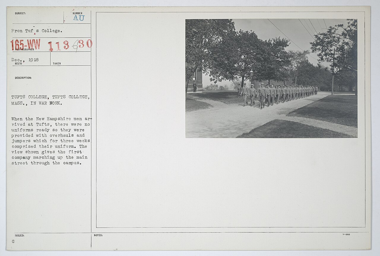 Scope and content: Original Caption: Tufts College, Massachusetts. When the New Hampshire men arrived at Tufts, there were no uniforms ready so they were provided with overhauls an
