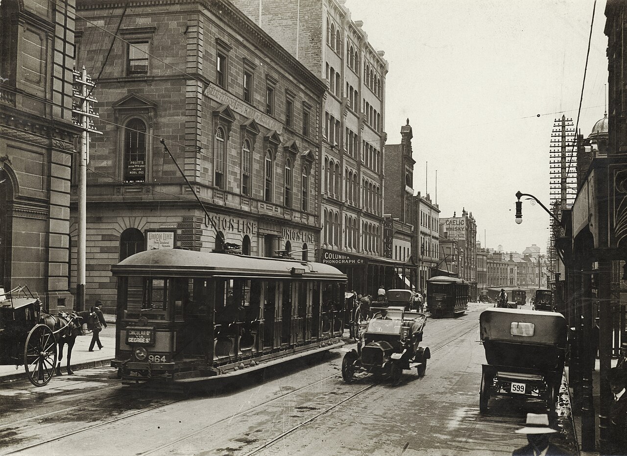 Looking north along George Street (with tram, T-model Ford and hansom cab) from Union Line Building (incorporating the Bjelke-Petersen School of Physical culture), corner Jamieson 