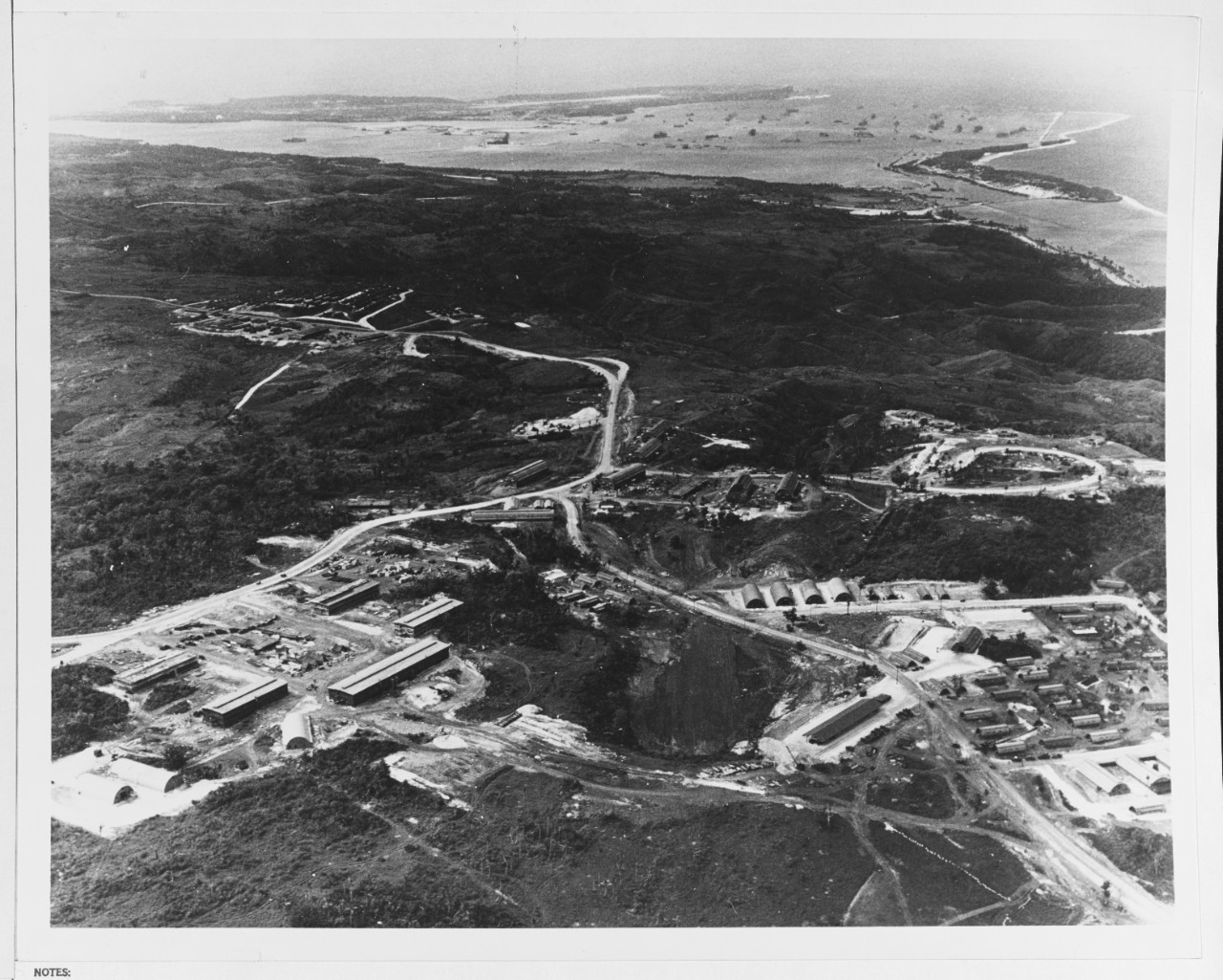 Aerial view showing the build-up of Fleet Admiral Chester W. Nimitz's Commander in Chief, U.S. Pacific Fleet (CinCPac)-Pacific Ocean Areas Command (POA) headquarters. Nimitz moved 