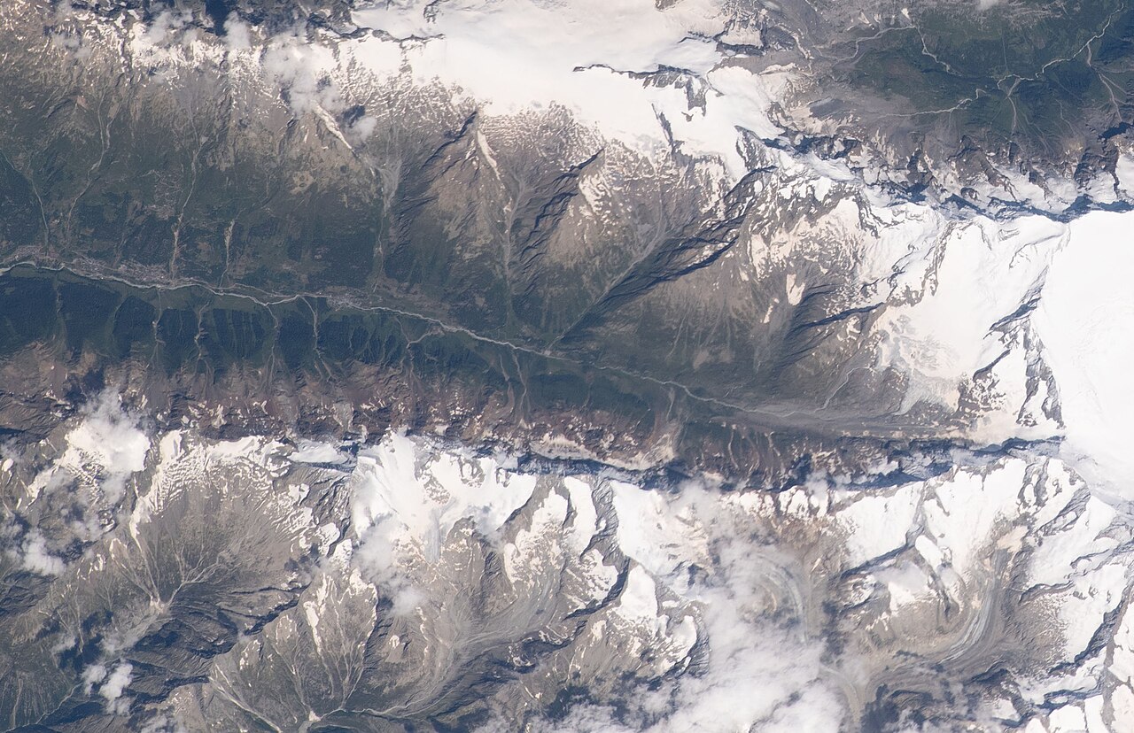 View of Switzerland taken during ISS Expedition 67. Bernese Alps in summer, Lötschental valley, river Lonza, villages Blatten , Wiler, Kippel. Mountain Bietschhorn , glaciers Nestg