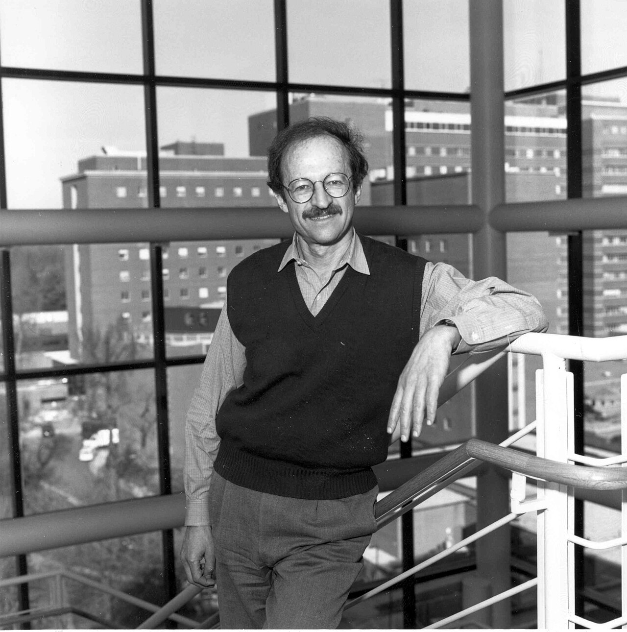 Harold Varmusi retired of director of the National Cancer Institute (NCI) in 2015. This photograph shows the Clinical Center (Building 10) in the background.